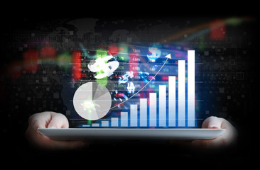 Business woman are checking stock market graph on digital tablet