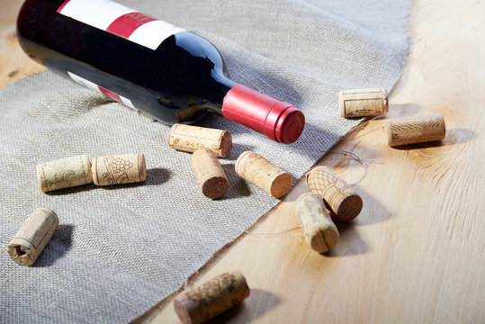 Wine and corks on wooden table