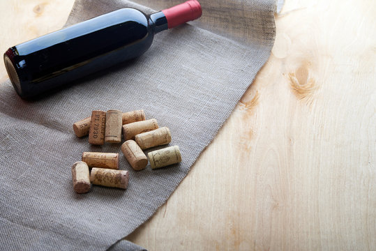 Wine and corks on wooden table