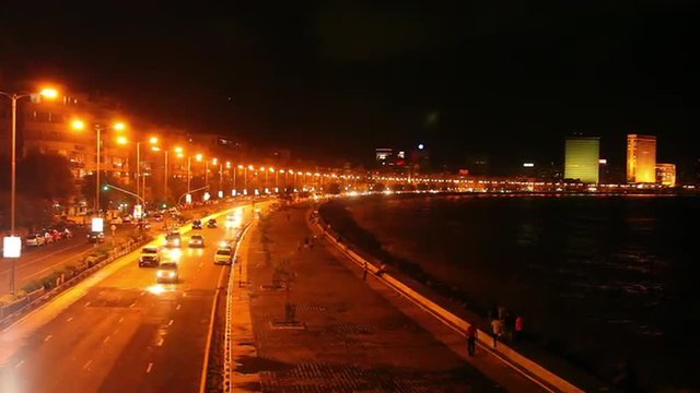 Time lapse shot of a city lit up at night, Marine Drive, Mumbai, Maharashtra, India