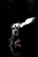 Fototapeta na wymiar Girl dancing with a flour