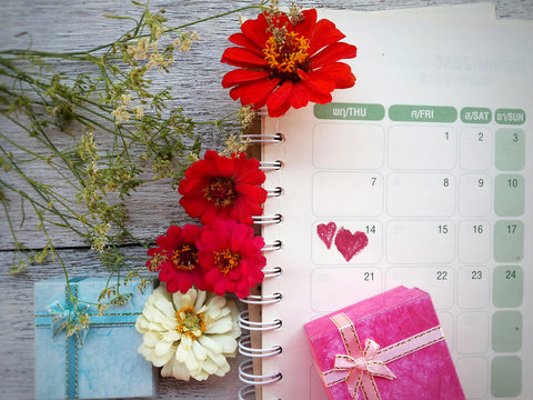 Calendar page with two red hearts on Valentine's day February 14  valentine concept and idea for decorative