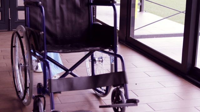Nurse staff bringing wheelchair 