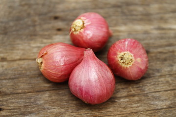 Shallots on the wood background