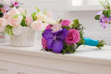 bridal bouquet from roses and an orchid
