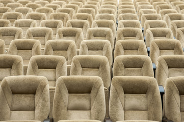 Fototapeta na wymiar Empty auditorium with beige chairs, theatre or conference hall