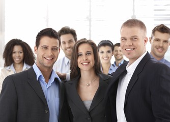 Group of happy successful business people smiling