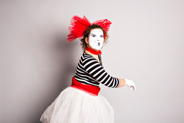 Portrait of a comedian  woman dressed up as a mime, April Fools Day concept
