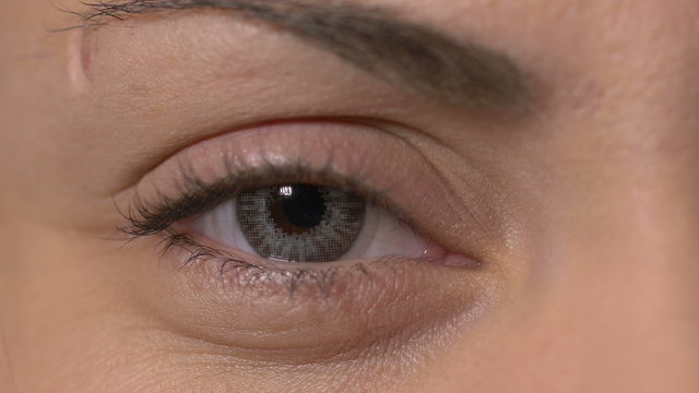 Close-up of a female eye with contact lens