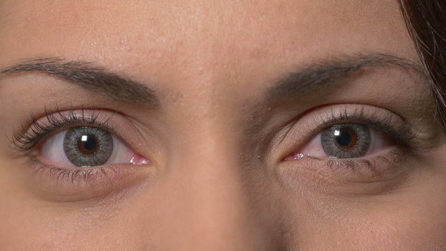 Female eyes with contact lenses opening
