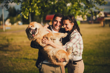 y couple and dog outdoor