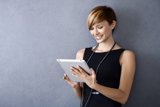 Young businesswoman using tablet