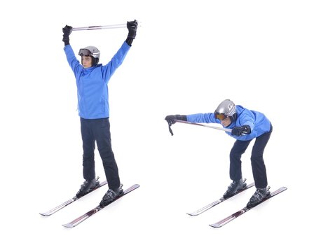 Skiier demonstrate warm up exercise for skiing. Bend forward wit