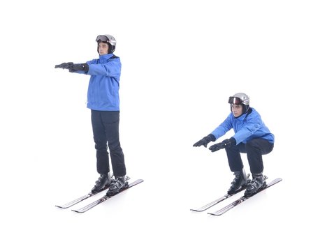 Skiier demonstrate warm up exercise for skiing. Squats on skis.