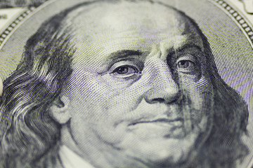 One hundred dollars close up as background