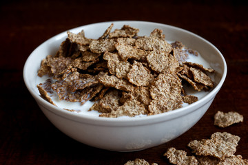 Wheat bran breakfast cereal in bowl.