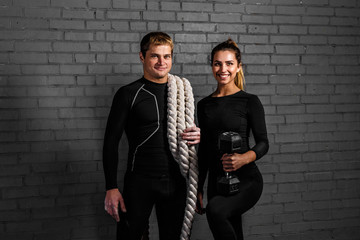 sportsmans with rope and dumbbell