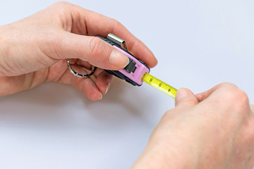 Stretching a tape measure. Picture is NOT isolated.