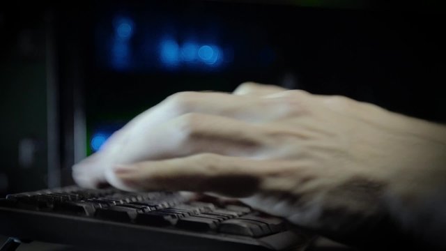 Hackerhand using computer with data code