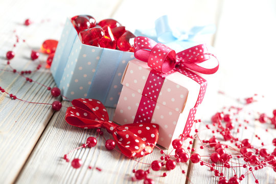 Colored gift boxes on wooden background