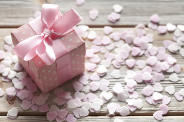 Pink gift box on abstract background