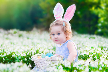 Little girl on Easter egg hunt