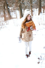 Fototapeta na wymiar Cute redhead girl in winter coat outdoors