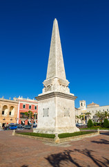 Fototapeta na wymiar Placa des born square obelisk at Cuitadella de Menorca, Spain.