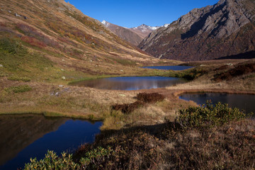 Fototapeta na wymiar Four small lake in the mountain valley. Caucasus. Sochi Region. Russia.
