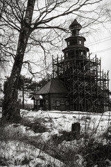 black and white photo of a wooden church.