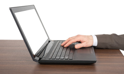 Businessmans hand working on laptop