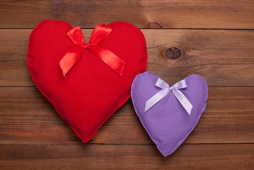 Two hearts on a wooden background. Gift for Valentine's Day.