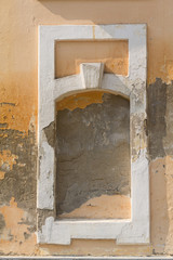 Old plaster and niche pledged window. Backgrounds and textures