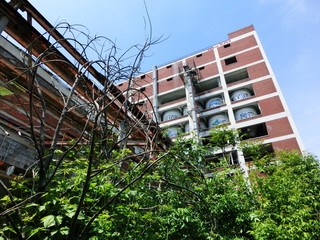 Abandoned brick warehouse with broken windows - landscape photo