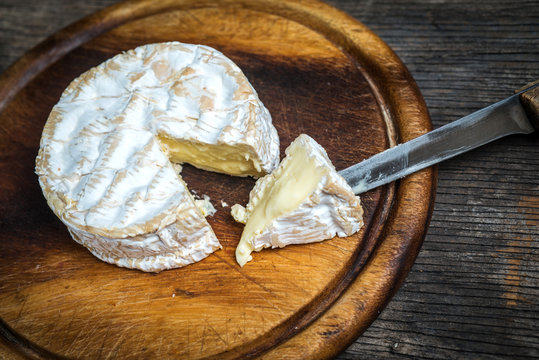 Camembert cheese with knife