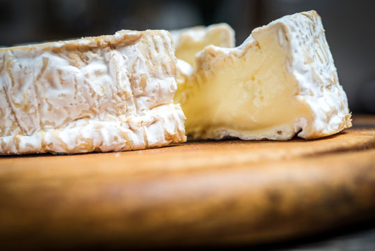 SLice of camembert cheese  rustic table