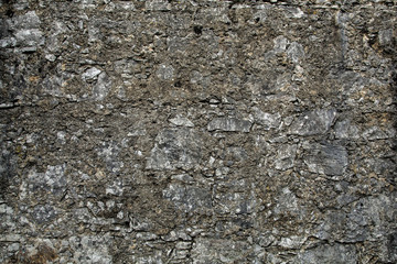 Grey textured stone wall without vignette effect