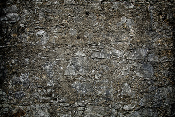 Grey textured stone wall with vignette effect