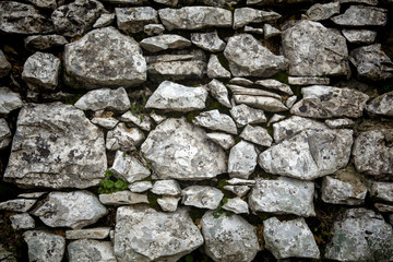 Grey textured stone wall with vignette effect
