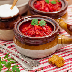 Borscht. Traditional Russian and Ukrainian national food - red beet soup. Selective focus.