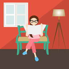 woman reading in corner  living room house home window glasses 