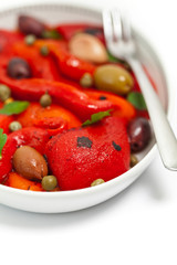 Roasted Red Pepper Salad on white background. Selective focus.