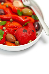 Roasted Red Pepper Salad on white background. Selective focus.