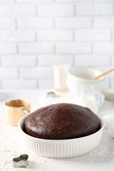 Cooked chocolate pie in a baking tray on a table
