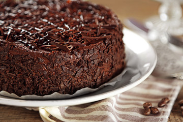Tasty chocolate cake on wooden background