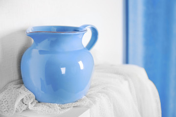 New blue dish on a shelf closeup