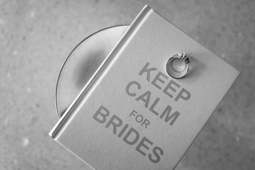 Bridal ring on book. B&W
