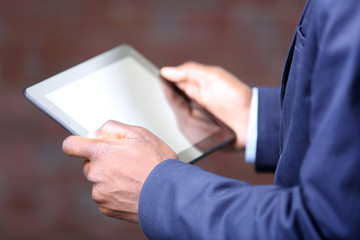 Male hands with tablet, close up