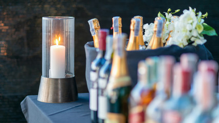 A candle light on brass stand in party.