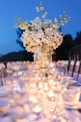 Romantic dinner setup, decoration with candle light. Selective focus.